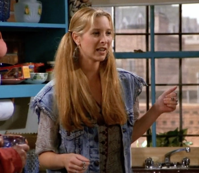 Phoebe wearing jeans vest