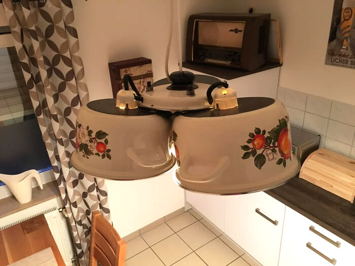 Lit kitchen lamp made of three pots