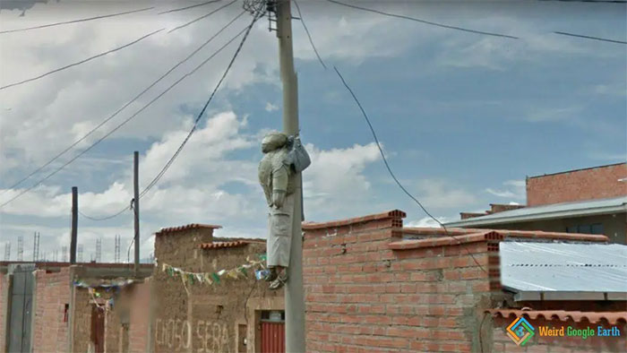 "“Person” Hanging From Electric Post". Location: El Alto, Bolivia