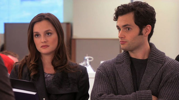 Blair wearing black coat, Dan wearing grey sweater 