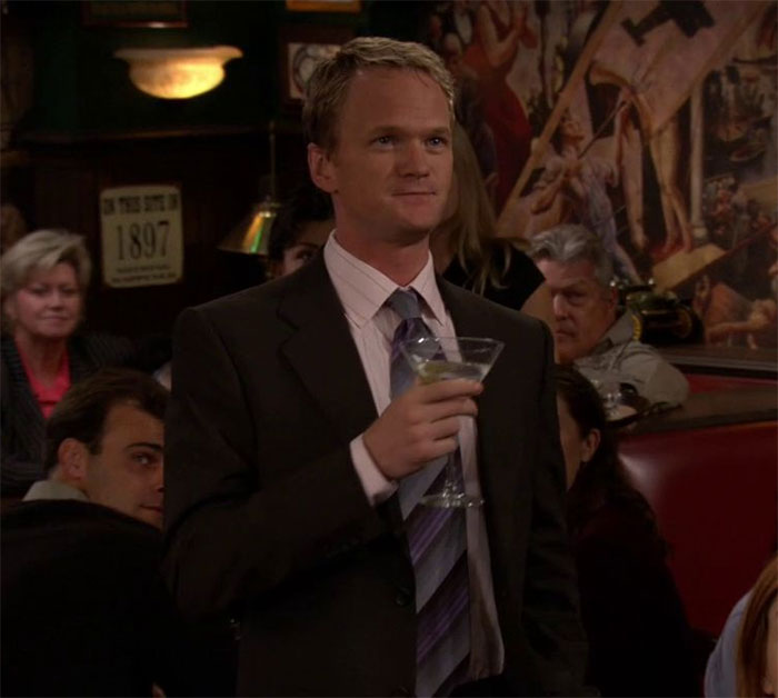 Barney Stinson drinking a coctail