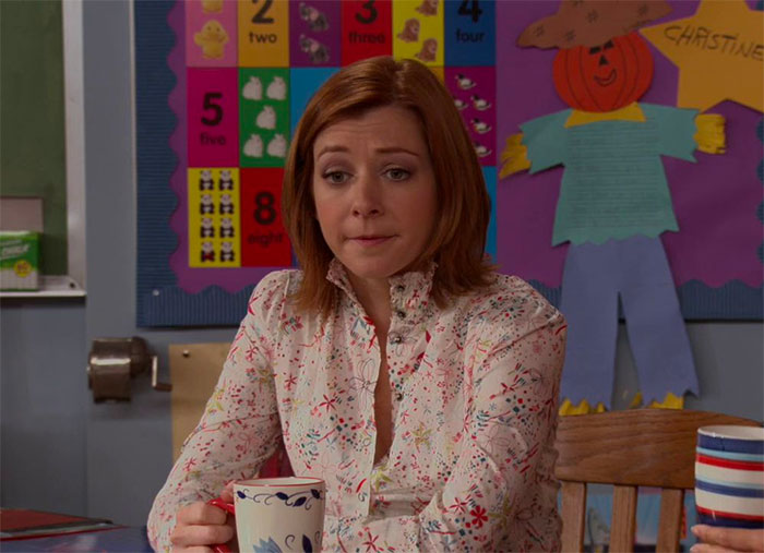 Lily Aldrin drinking tea in classroom