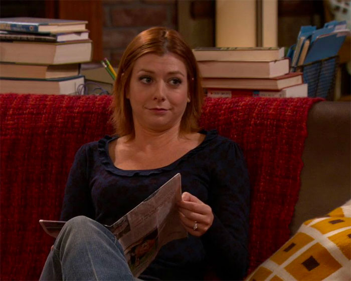 Lily Aldrin reading a newspaper
