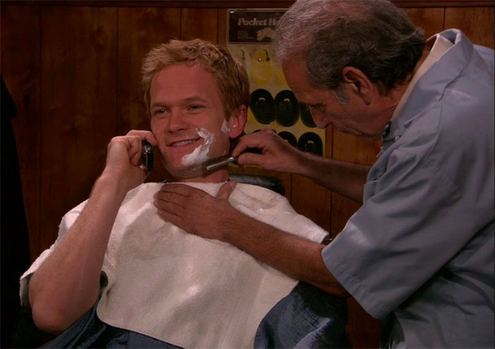 Barney Stinson with barber shaving his beard