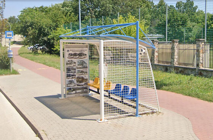 This Bus Stop Next To A Football Field