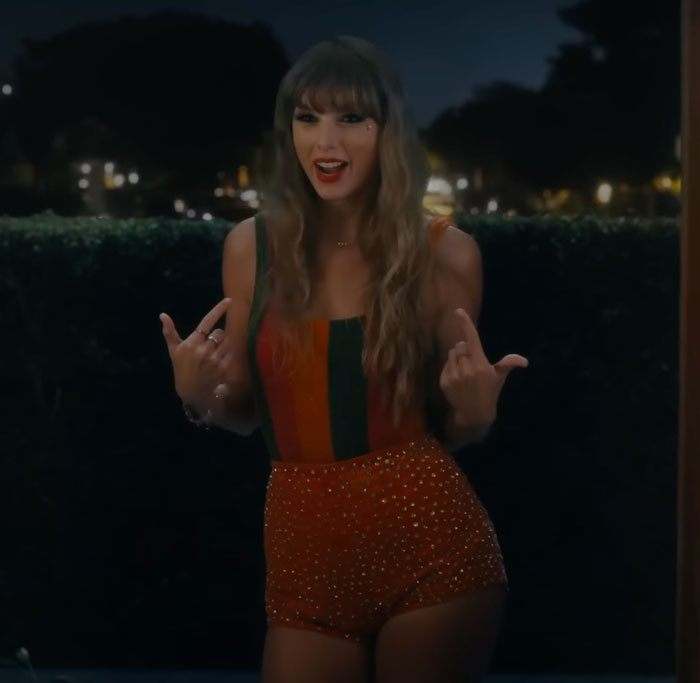 Taylor Swift pointing fingers at herself 