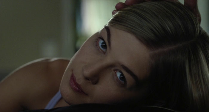 Woman laying and looking forward 