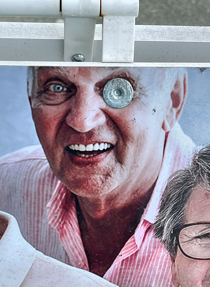 Sandwich Board Advertising Seniors Day But Because Of This Fastener Placement, It Looks Creepy