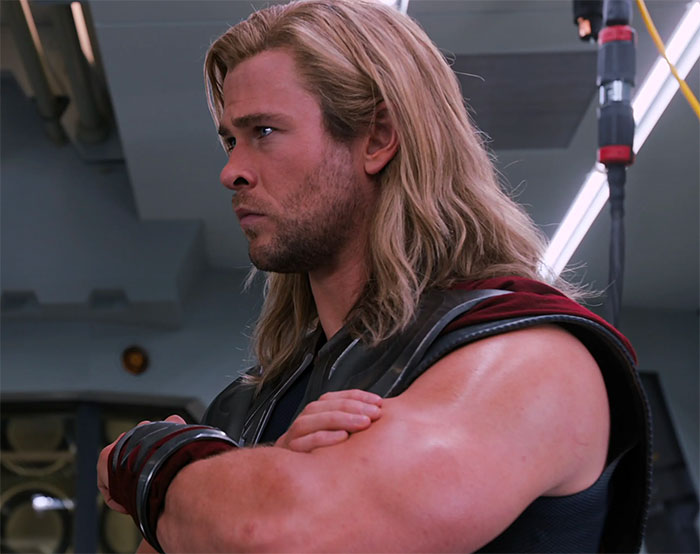 Thor is standing hands crossed