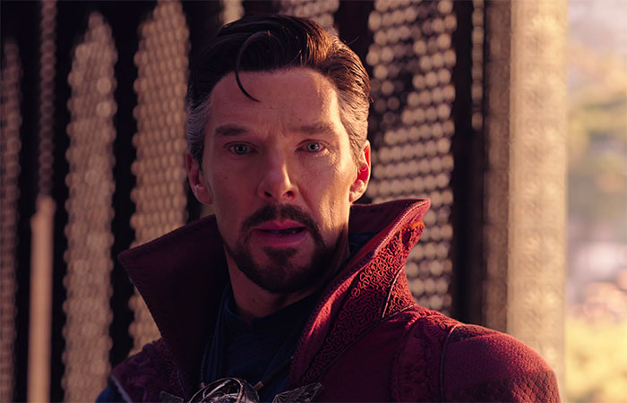 Doctor Strange in a red coat and his mouth is open