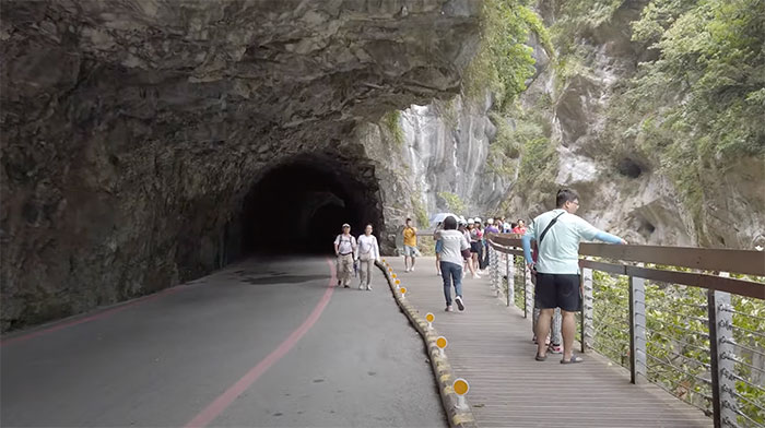 Picture of people walking on Taroko Gorge road in Taiwan