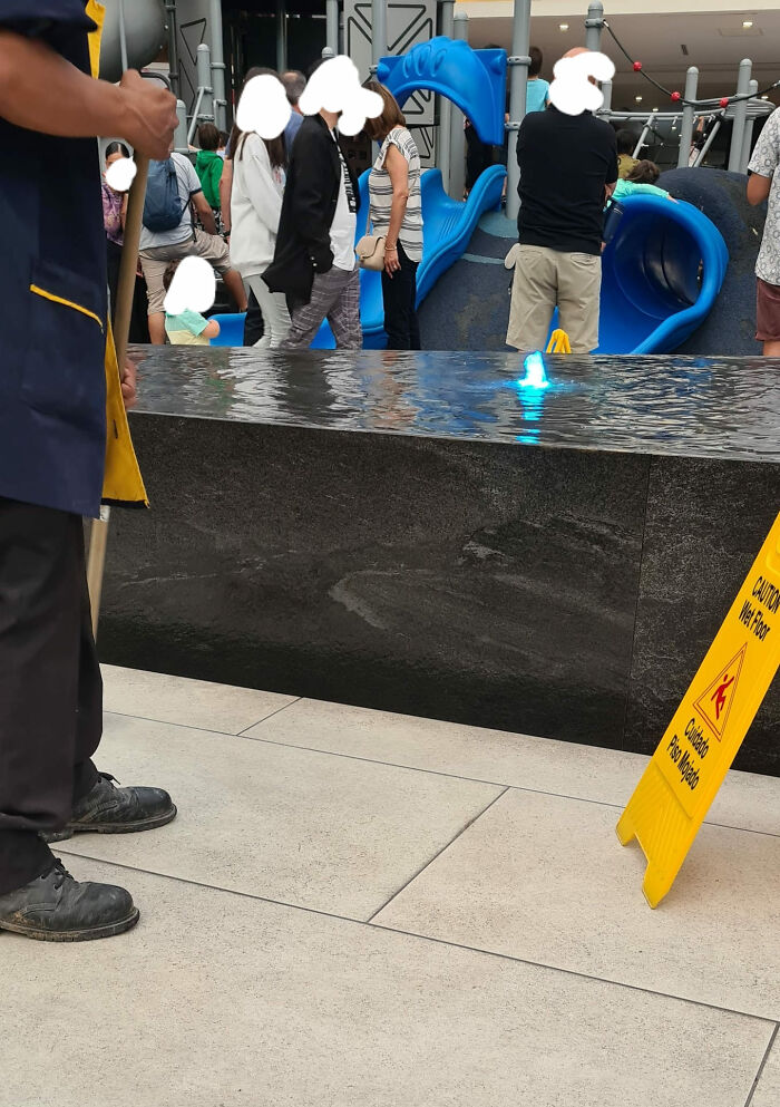 This Fountain Thingy At A Mall In The City Where I Live. There's Literally Someone Mopping The Whole Time Because The Part Where The Water Falls Is Too Shallow, And The Water Splashes All Over The Place