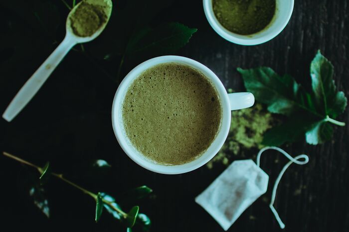 Matcha Green Tea In A Mug And In A Spoon 