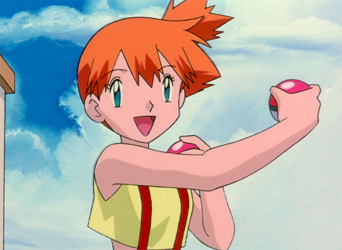 Misty Williams is happy and holds poke balls in both hands