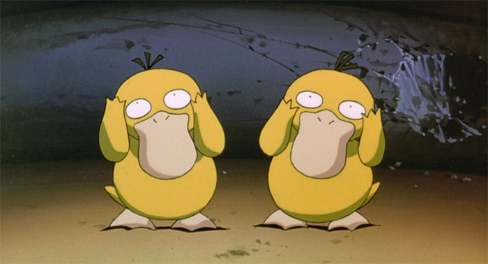 Two psyducks with their hands up