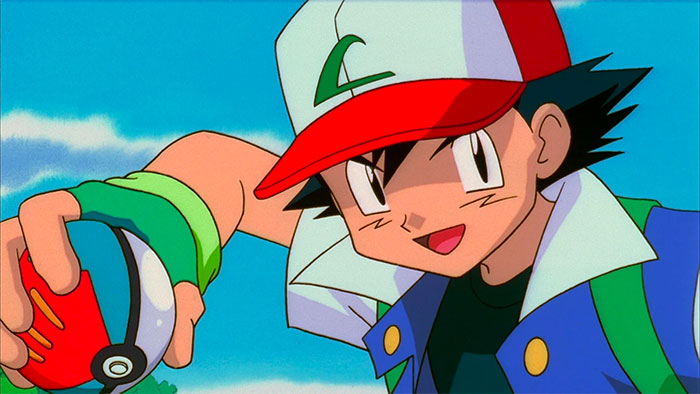 Ash Ketchum holds a poke ball in his right hand and is preparing to throw