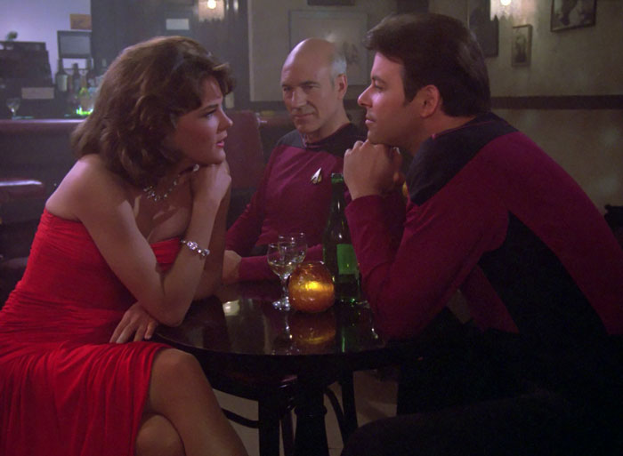 Minuet and Captain Jean-Luc Picard and Kirk sitting at a table