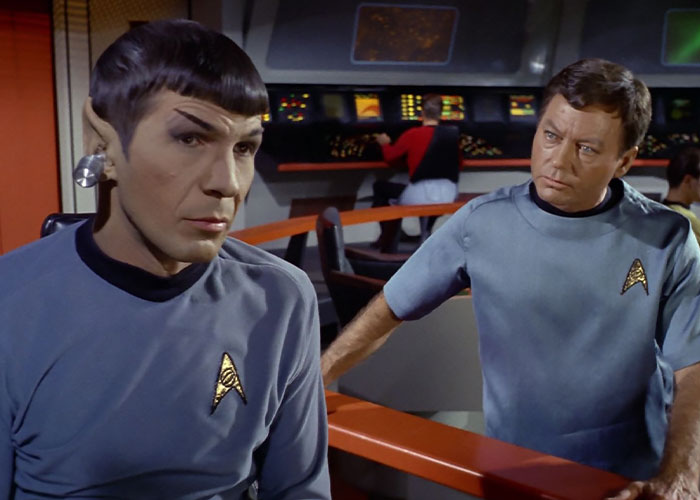 Doctor McCoy looking at Spock