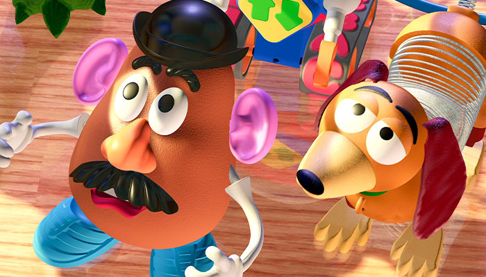Mr. Potato head and slinky dog looking up