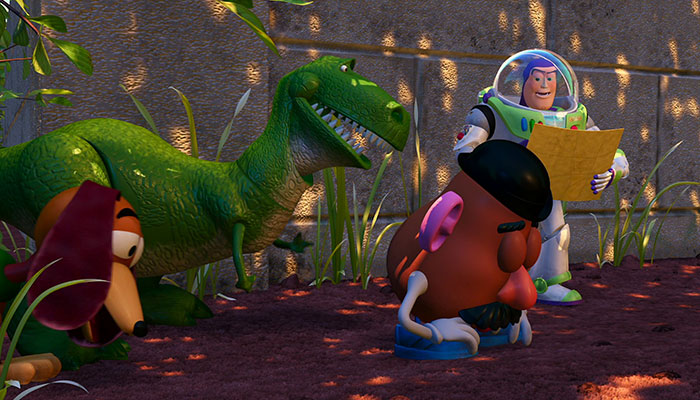 Buzz explaining his plan to rex, mr.potato head and slinky dog