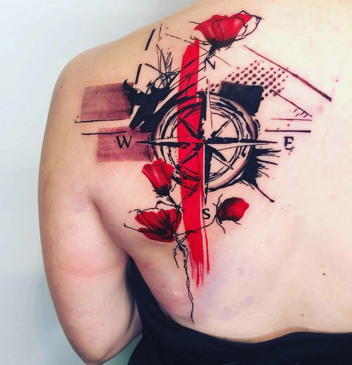 Compass and flowers tattoo on back
