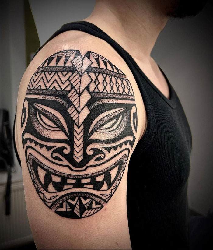 tribal mask tattoo