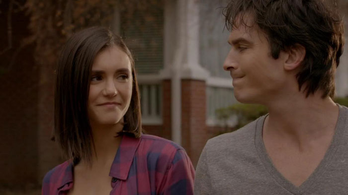 Elena and Damon smiling at each other 