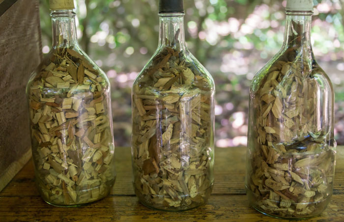 three jars with wood chips