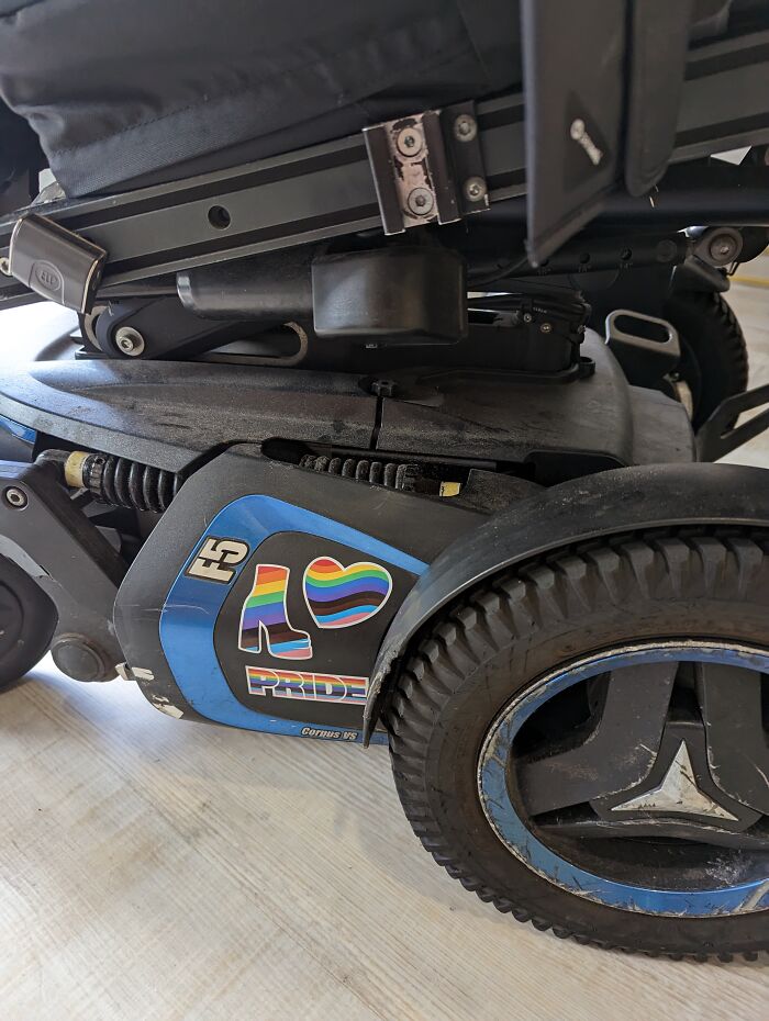On My Husband's Wheelchair. Stickers From Steve Madden. Supporting Our Trans Daughter