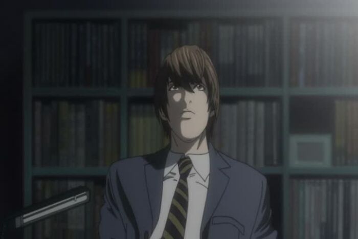 Light Yagami sitting and thinking from Death Note