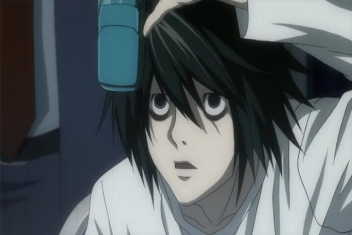 L Lawliet holding phone from Death Note