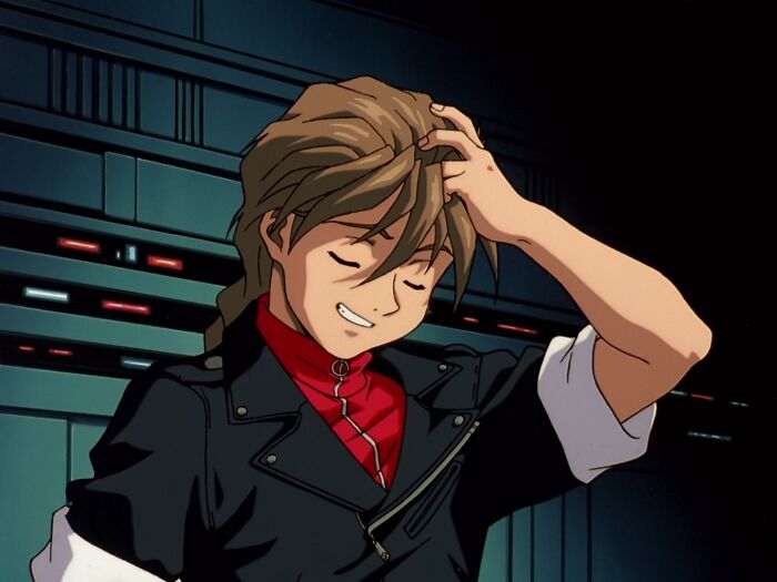 Duo Maxwell holding head and laughing from Gundam Wing