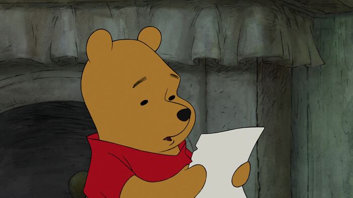 Winnie the Pooh reading a letter