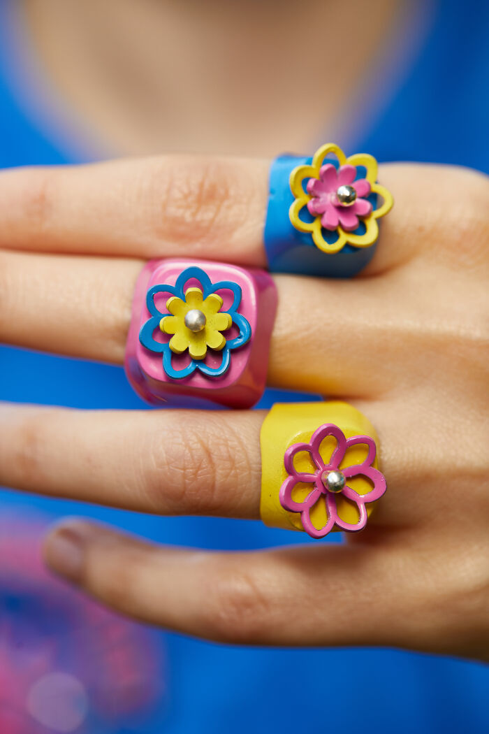 A Colorful Array Of Floral Moving Flowers Rings