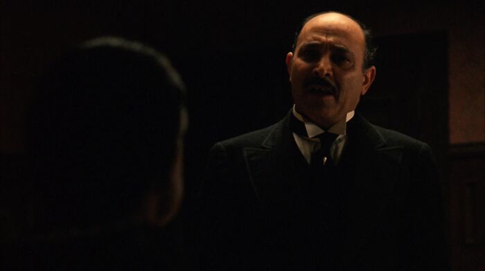 Amerigo Bonasera speaking with don vito corleone