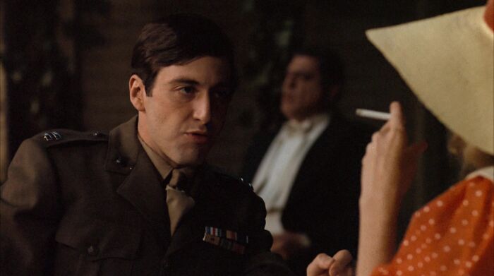 Michael Corleone looking forward and talking 