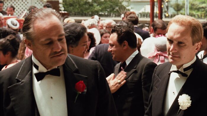 Don Vito Corleone talking at a wedding 