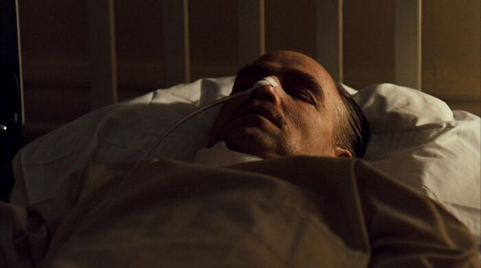 Don Vito Corleone laying in bed