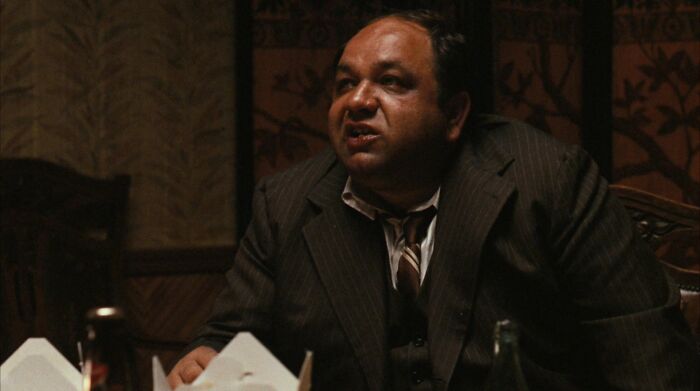 Peter Clemenza talking at the table 
