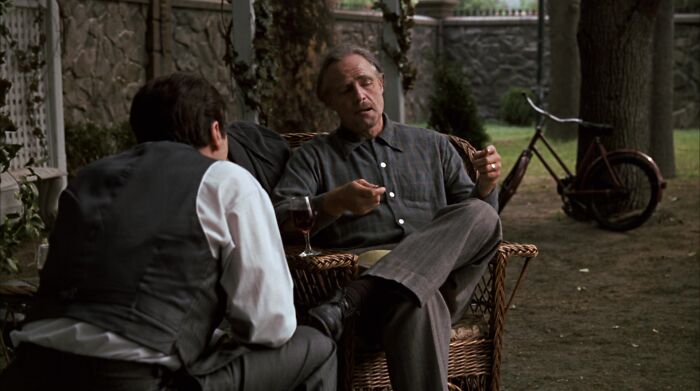 Don Vito Corleone talking with Michael