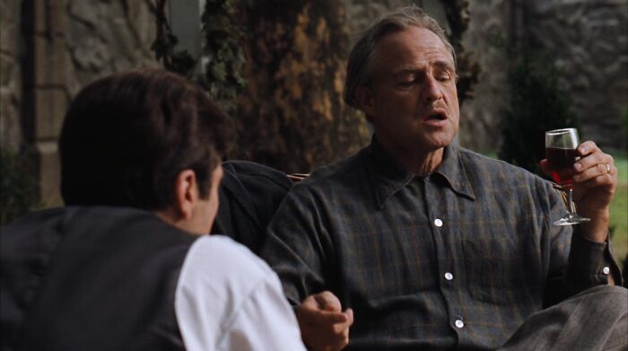 Don Vito Corleone drinking wine 