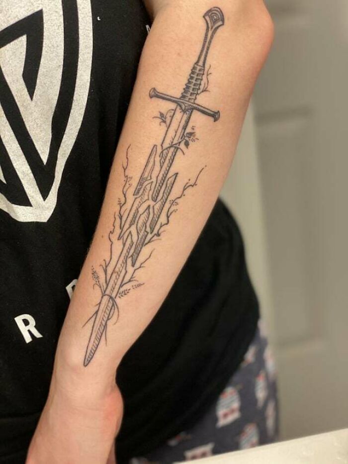 Shards of Narsil with plant around it tattoo 