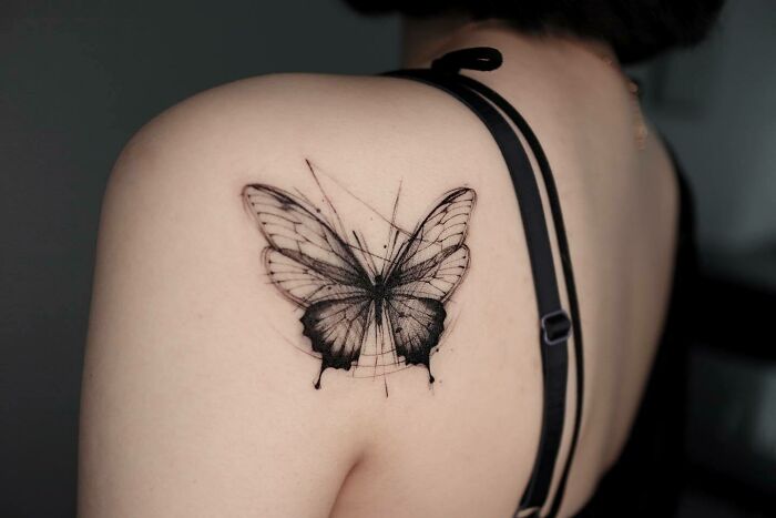 watercolor butterfly back shoulder tattoo