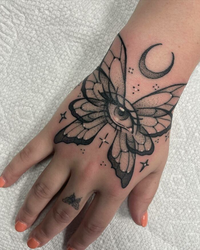 Butterfly With Eye moon and stars hand Tattoo