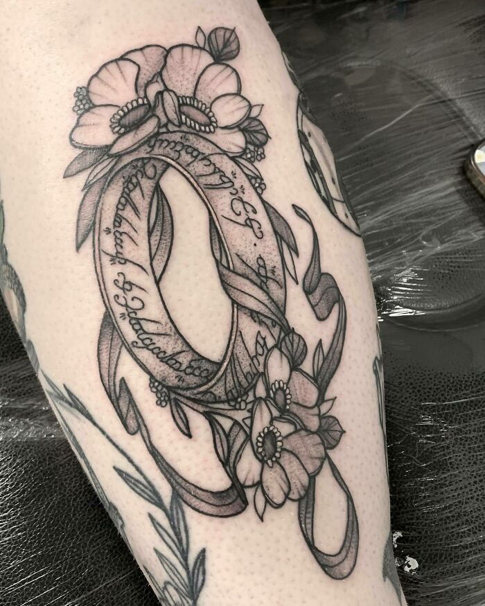 The one ring with flowers tattoo 