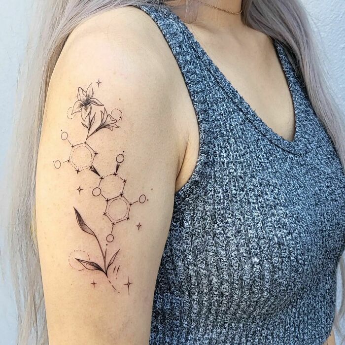 Epicatechin molecule with jasmine flowers tattoo on arm