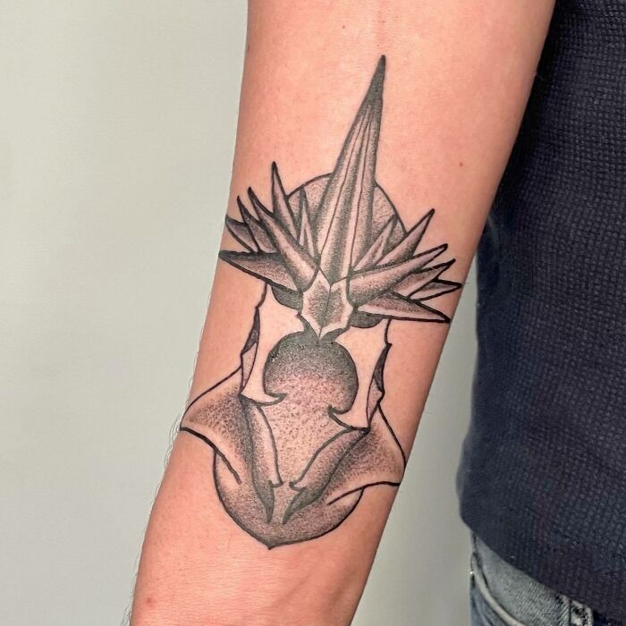 Sauron's helmet arm tattoo