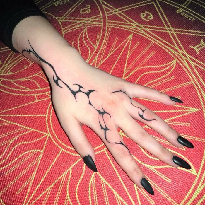 Neo tribal black abstract tattoo on hand