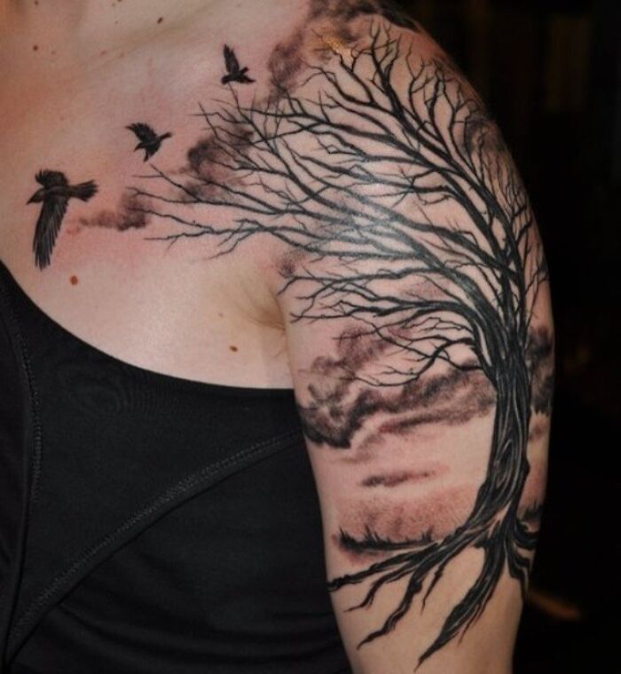 Tree and flying birds tattoo