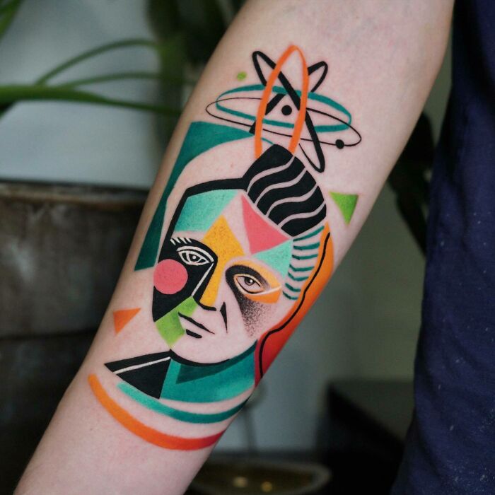 Maria Curie colorful geometric tattoo on arm